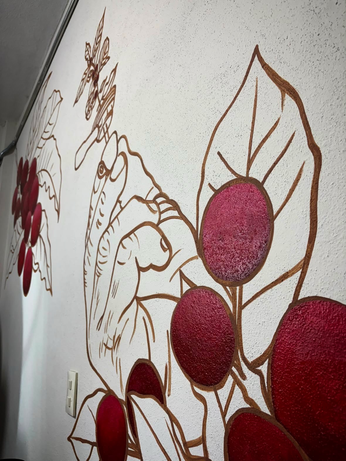 Mural sobre el viaje del café en la casa tostadora